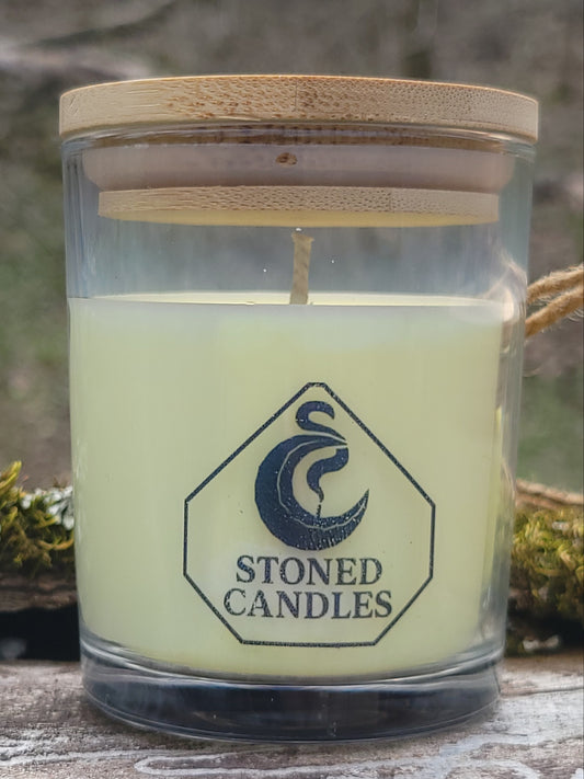 Candle in a glass jar with a wooden lid, featuring the 'Stoned Candles' brand logo.